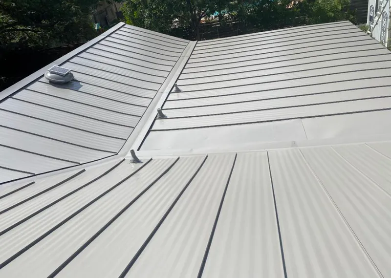 Solar attic fan installed on a metal roof for Roof Ventilation in Gresham Park